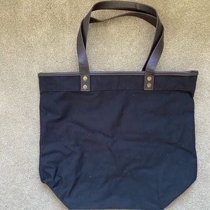 Canvas Tote Bag with vegan leather handles and laminated interior.